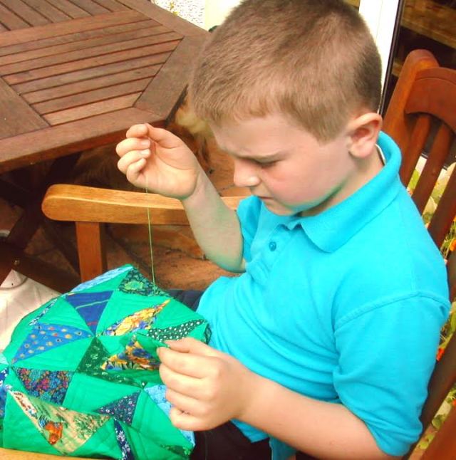 Sewing with his Granny